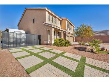 Two-story house with a large driveway and RV gate at 5728 Collier Falls Ave, Las Vegas, NV 89139