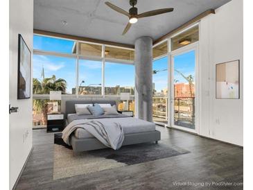 Modern main bedroom featuring high ceilings, large windows with outside view, and neutral tones at 353 E Bonneville Ave # 313, Las Vegas, NV 89101