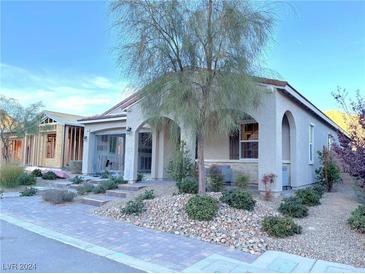 Single-story home with covered porch and landscaped yard at 36 Honeymoon Dr, Henderson, NV 89011