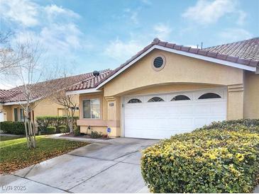 Attractive single-story home with a two-car garage and well-manicured landscaping at 6409 Sierra Diablo Ave, Las Vegas, NV 89130