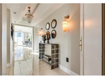 Elegant hallway features a crystal chandelier, sconces, and stylish decor at 2747 Paradise Rd # 2206, Las Vegas, NV 89109