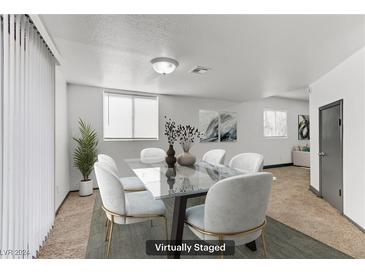 Bright dining room featuring modern glass table, seating for six, neutral walls, and natural light at 538 Kristin Ln, Henderson, NV 89011