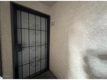 Apartment entry with security door and number plaque at 2606 S Durango Dr # 172, Las Vegas, NV 89117