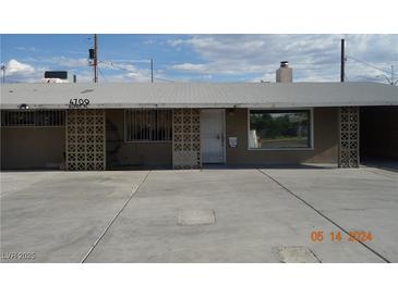 Single story home featuring a neutral color scheme and large front windows providing great curb appeal at 4709 W Alpine Pl, Las Vegas, NV 89107