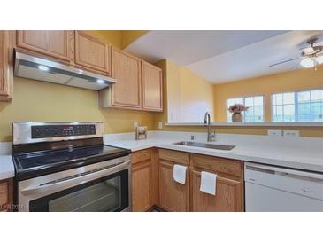 Well-lit kitchen features stainless steel appliances and modern countertop at 2020 Rancho Lake Drive Dr # 205, Las Vegas, NV 89108