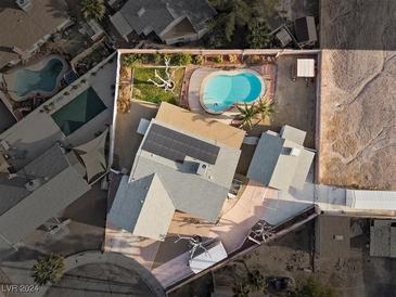 Aerial view of house, pool, and surrounding landscape at 4767 Del Sueno Dr, Las Vegas, NV 89120