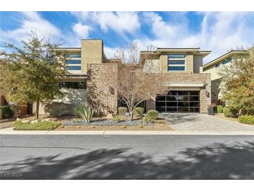 Stunning modern home with stone accents and a large garage at 5 Moonfire Dr, Las Vegas, NV 89135