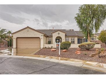 Charming single-story home featuring a tile roof, two-car garage and low maintenance landscaping at 3005 Noblesville Ct, Henderson, NV 89052