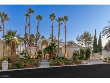 Stunning two-story home with palm trees and landscaped grounds at 8109 Moonstone Cir, Las Vegas, NV 89128