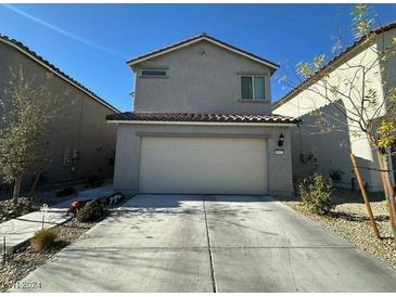 Two-story house with attached garage and desert landscaping at 6843 Toros St, North Las Vegas, NV 89086