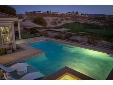 Inviting backyard pool and golf course views create a relaxing outdoor oasis at 2835 Somerset Springs Dr, Henderson, NV 89052