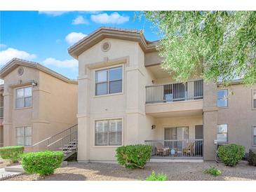 Two-story condo building with private balcony and landscaping at 8000 W Badura Ave # 2106, Las Vegas, NV 89113