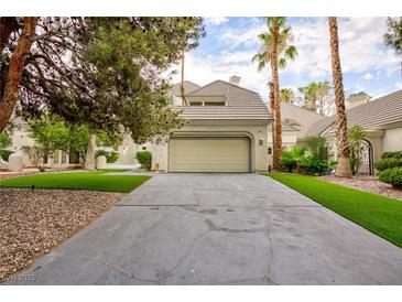 Charming single-Gathering home with a two-car garage, concrete driveway, and mature trees at 3146 Bel Air Dr, Las Vegas, NV 89109