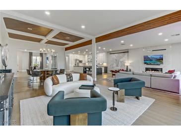 Open living area features hardwood floors, high ceilings, and a modern aesthetic at 2080 Orchard Mist St, Las Vegas, NV 89135