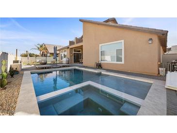 Beautiful backyard pool and spa, perfect for relaxing and entertaining at 5944 Vizzi Ct, Las Vegas, NV 89131