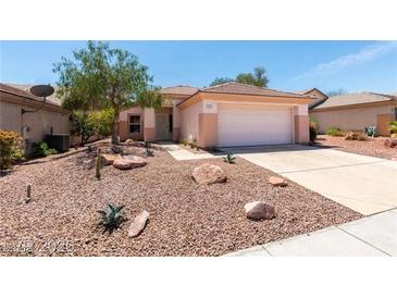 One-story house with desert landscaping, attached garage, and driveway at 2179 Point Mallard Dr, Henderson, NV 89012