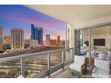 Spacious balcony with city views and seating area at 222 Karen Ave # 1702, Las Vegas, NV 89109