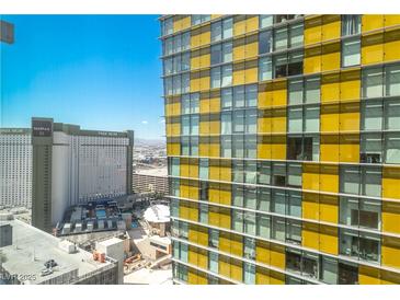 This high-rise building features a modern design with many windows offering city views at 3722 Las Vegas Blvd # 2309, Las Vegas, NV 89158