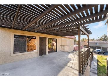 Covered patio with pergola and views of the surrounding area at 1865 Apricot Ct, Henderson, NV 89014