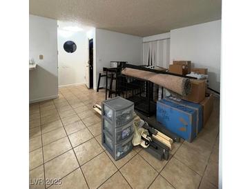 Spacious living room with tile floors and lots of natural light at 2961 Juniper Hills Blvd # 102, Las Vegas, NV 89142