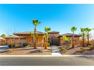 Single-story home with a terracotta roof, palm trees, and a paved driveway at 5024 Crown Cypress St, Las Vegas, NV 89149