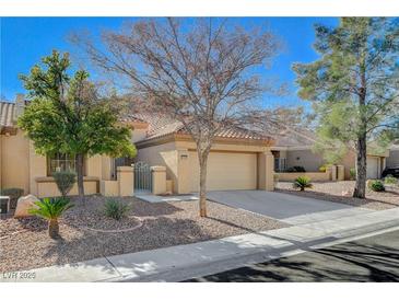 Charming single-story home features a well-manicured front yard, tiled roof, and two car garage at 8805 Litchfield Ave, Las Vegas, NV 89134
