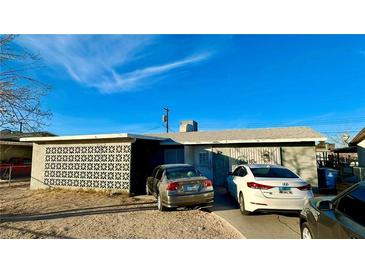 Ranch style home with carport and mature trees at 1924 Hart Ave, North Las Vegas, NV 89032