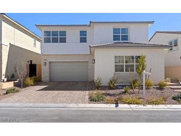 Charming two-story home with a brick driveway and well-maintained landscaping at 8990 Rolling Pietra St, Las Vegas, NV 89166