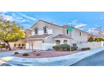 Two-story house with a landscaped yard and a two-car garage at 1605 Calle Montery St, Las Vegas, NV 89117