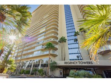 Regency Towers building exterior, featuring palm trees and building signage at 3111 Bel Air Dr # 4G, Las Vegas, NV 89109