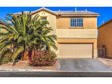 Two-story house with beige exterior, palm tree, and attached garage at 6228 Wood Stork Ave, Las Vegas, NV 89122