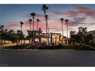 Stunning desert contemporary home with palm trees and landscaped grounds at 7880 Dana Point Ct, Las Vegas, NV 89117