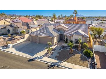 Aerial view of a single-Gathering home with a two-car garage and desert landscaping at 816 Sandsprings St, Henderson, NV 89011