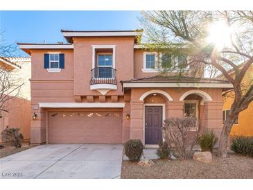 Two-story house with a two-car garage and landscaping at 8809 Early Horizon Dr, Las Vegas, NV 89178