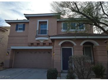 Two-story house with attached garage and balcony at 8809 Early Horizon Dr, Las Vegas, NV 89178