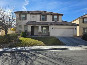 Two-story house with brown roof and landscaping at 1113 Dawn Valley Dr, North Las Vegas, NV 89031