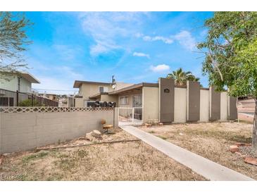 Building exterior showing a walkway to the entrance and landscaping at 3217 Joann Way, Las Vegas, NV 89108