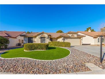 Single-story house with landscaped lawn and two-car garage at 5728 Palma Del Sol Way, Las Vegas, NV 89130