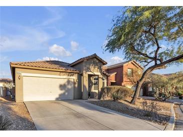 One-story house with a two-car garage and desert landscaping at 6452 Casamar St, North Las Vegas, NV 89086