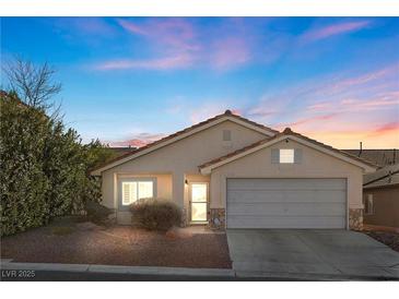 One-story house with attached garage, landscaping, and neutral color scheme at 6501 Grand Oaks Dr, Las Vegas, NV 89156