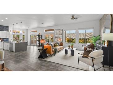 Bright, open living room with hardwood floors and plenty of natural light at 10300 Bent Brook Pl, Las Vegas, NV 89134