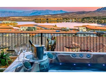 Luxury hot tub with lake and mountain views; perfect for relaxation at 116 Stone Mesa Ct, Henderson, NV 89011