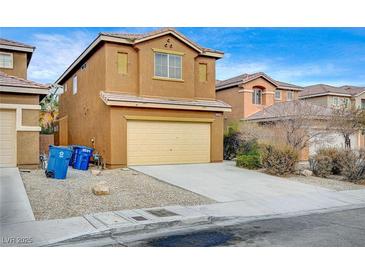 Two-story house with attached garage and desert landscaping at 9204 Weeping Hollow Ave, Las Vegas, NV 89178