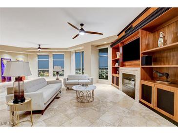 Spacious living room with city views, fireplace, and hardwood floors at 9101 Alta Dr # 502, Las Vegas, NV 89145