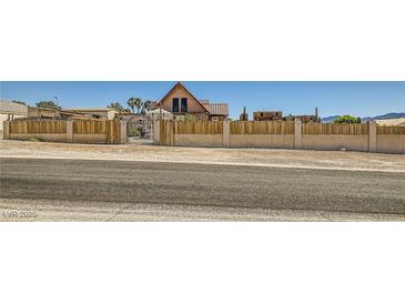 Charming home featuring a rustic fence for privacy at 919 Havre Ave, Henderson, NV 89015