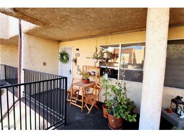 Cozy balcony with outdoor seating, potted plants, and a view; perfect for relaxing and enjoying the fresh air at 1303 Darlene Way # 102B, Boulder City, NV 89005