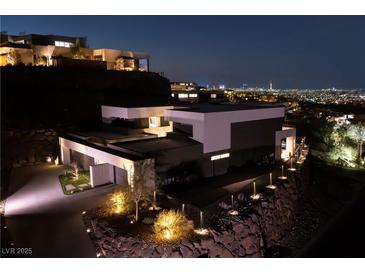 Stunning modern home with city views, private driveway and professional landscaping at 609 Sleeping Dragon Dr, Henderson, NV 89012