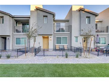 Modern 2-story townhome with private patio and fenced yard at 6815 Sage Gold Ct, North Las Vegas, NV 89086