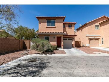 Charming two-story home with stucco exterior, red tile roof, and an attached one car garage at 3396 Villa Fiori Ave, Las Vegas, NV 89141