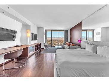 Modern bedroom with a king-size bed and stunning city views at 4381 W Flamingo Rd # 3819, Las Vegas, NV 89103